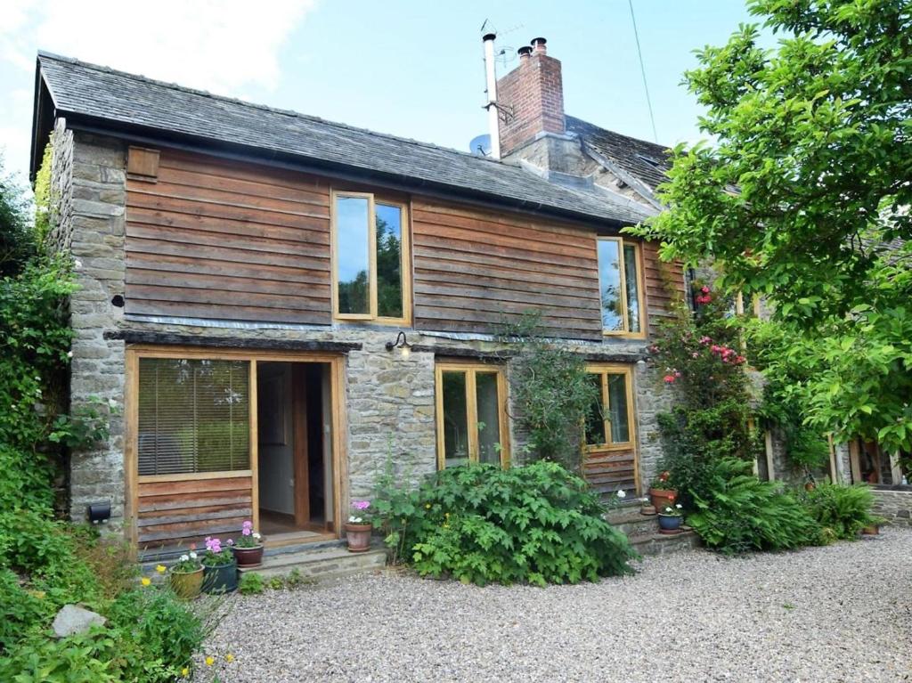 an old stone house with wooden walls and windows at 2 Bed in Presteigne oc-78095 in Presteigne