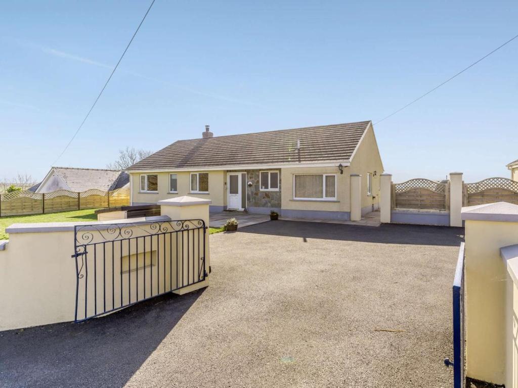 a house with a large driveway in front of it at 3 Bed in Clynderwen oc-73936 in Maenclochog
