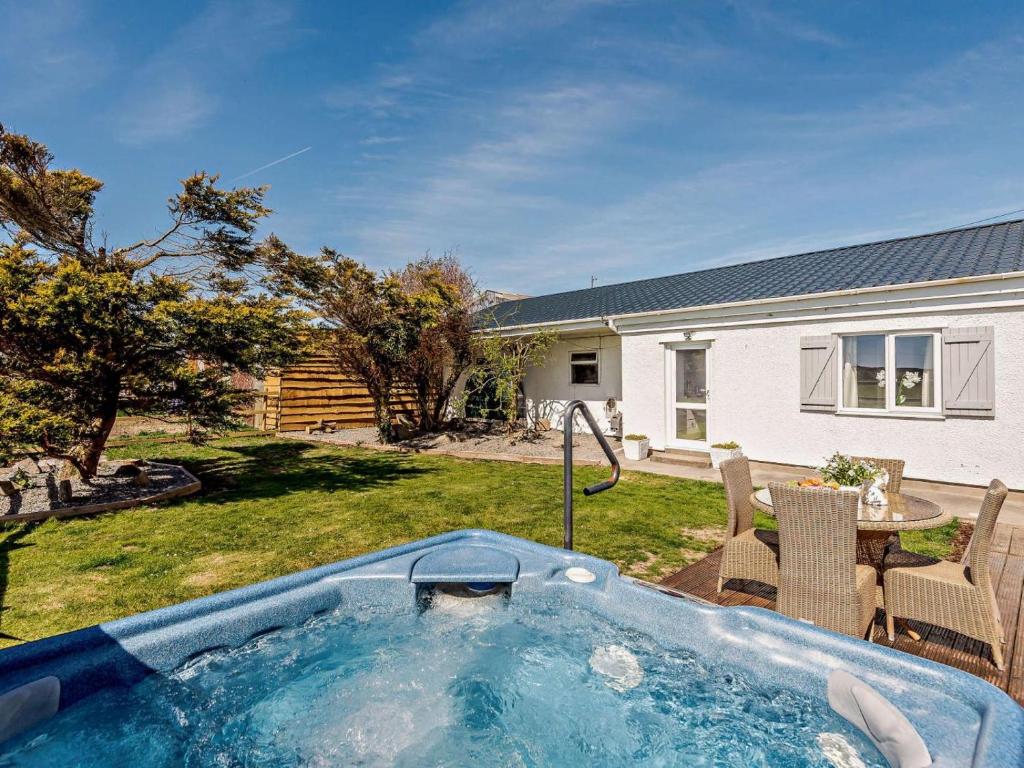 a hot tub in the yard of a house at 2 Bed in Holyhead oc-81515 in Caeʼr-geiliog