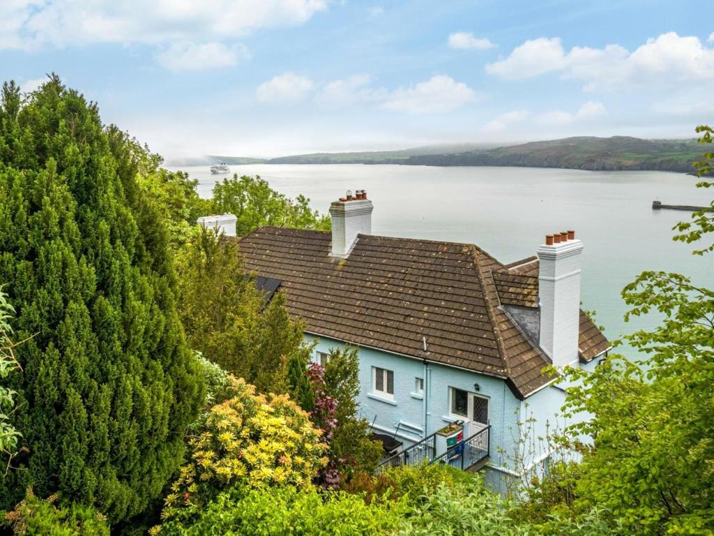 a house on a hill with a view of a lake at 1 Bed in Goodwick oc-fb158 in Goodwick