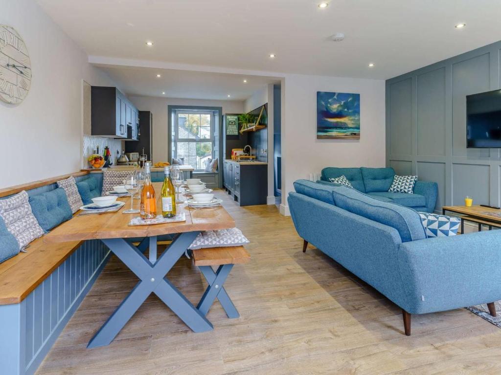 a kitchen and living room with a table and a couch at 3 Bed in New Quay oc-83998 in New Quay
