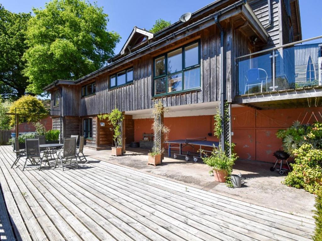 a house with a wooden deck with a patio at 4 Bed in Newtown oc-48641 in Kerry