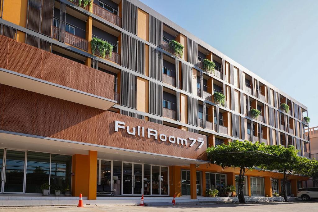 a building with a fullerton sign on the side of it at Fullroom 77 Srinakarin in Samutprakarn