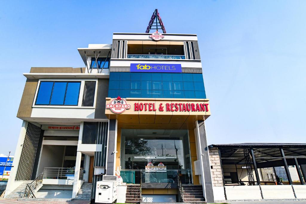a building with a sign on top of it at FabHotel The Backyard Bowl in Indore