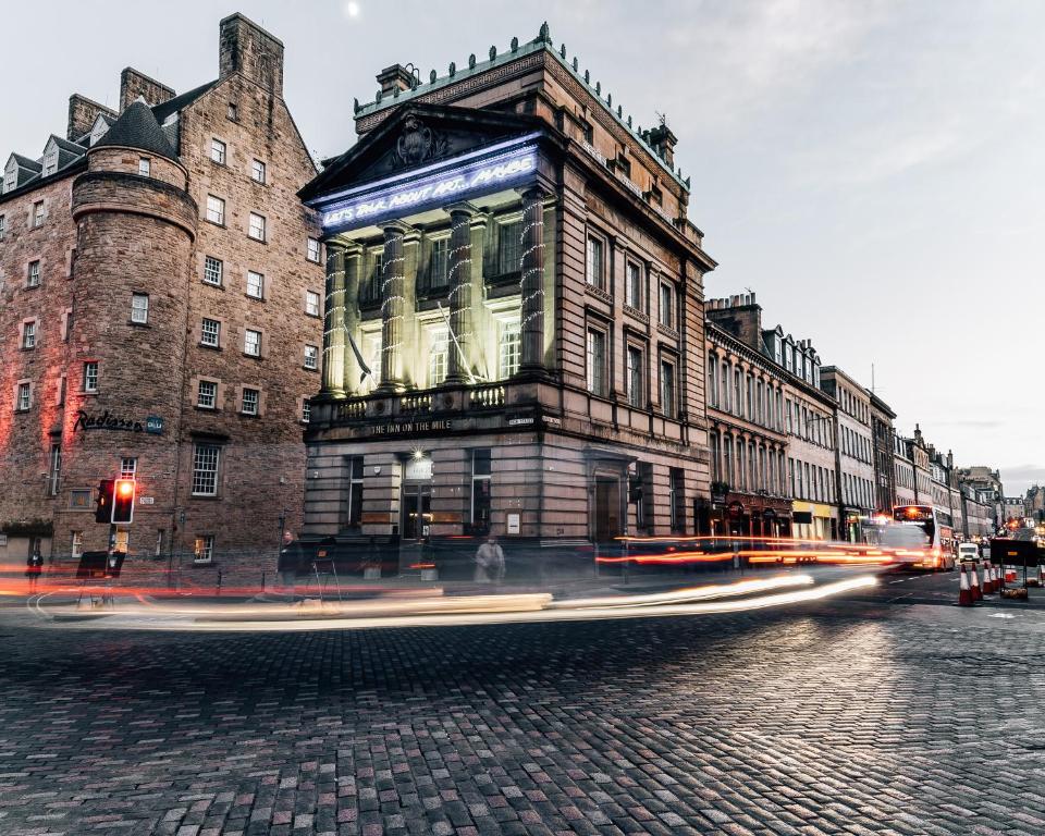 a building on the corner of a city street at The Inn on the Mile in Edinburgh