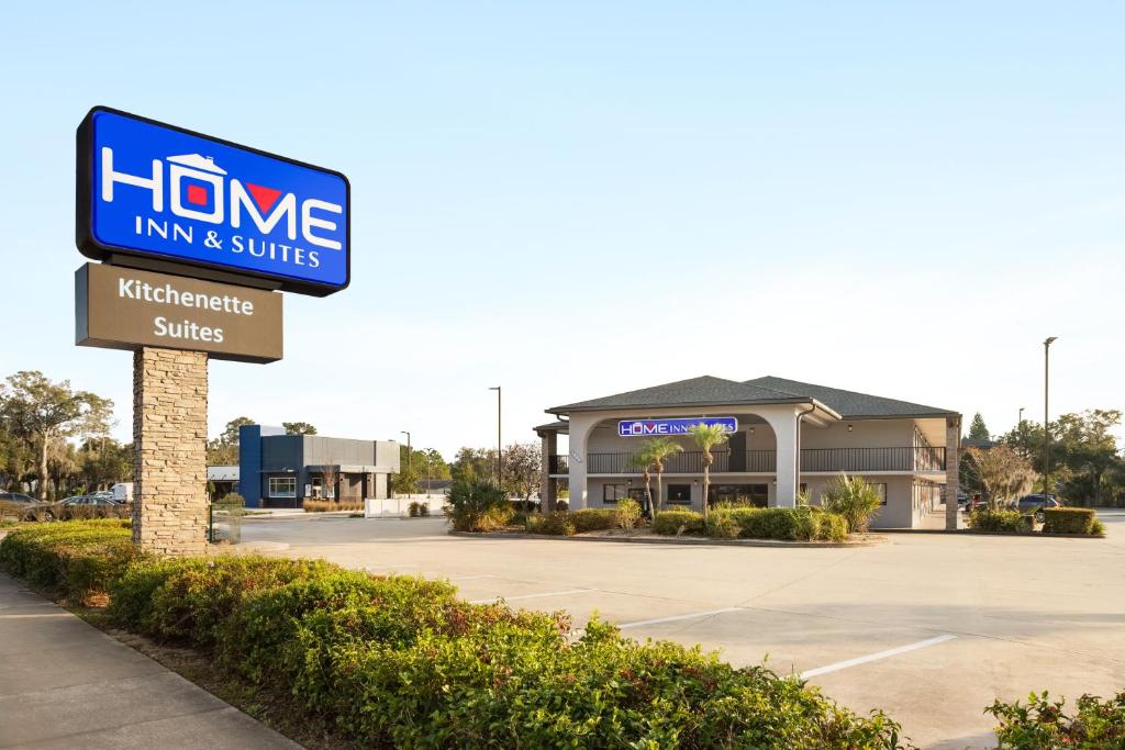 a home inn and suites sign in front of a building at Home Inn & Suites in Orlando