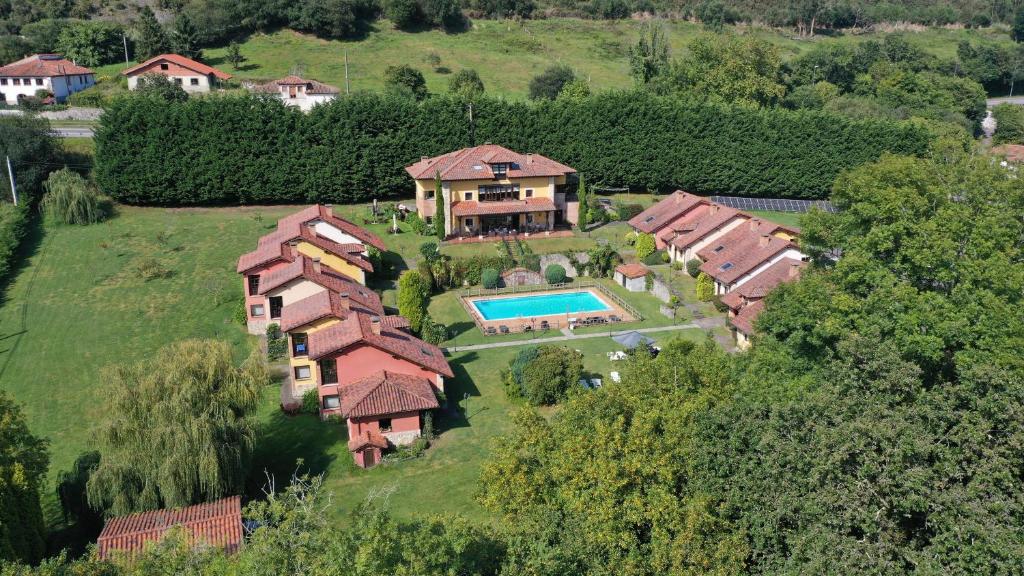 an aerial view of a house with a swimming pool at Hotel La Lluriga in La Galguera