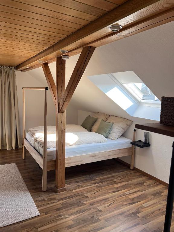 a bedroom with a bed with a skylight at De Bookholt - Premium Ferienwohnung in Vreden