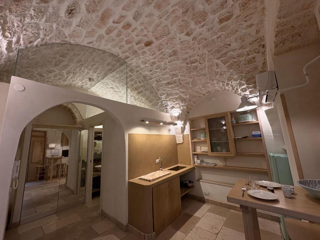 a kitchen with a ceiling with a design on it at Opera Prima - Luxury Homes in Ceglie Messapica