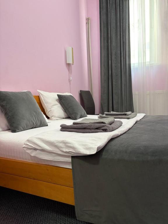 a bedroom with two beds with towels on them at Mini-Hotel Ocean in Kyiv