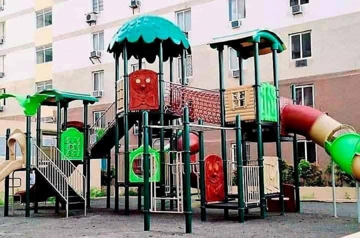 a park with a playground with a slide at AAvista in Basbas