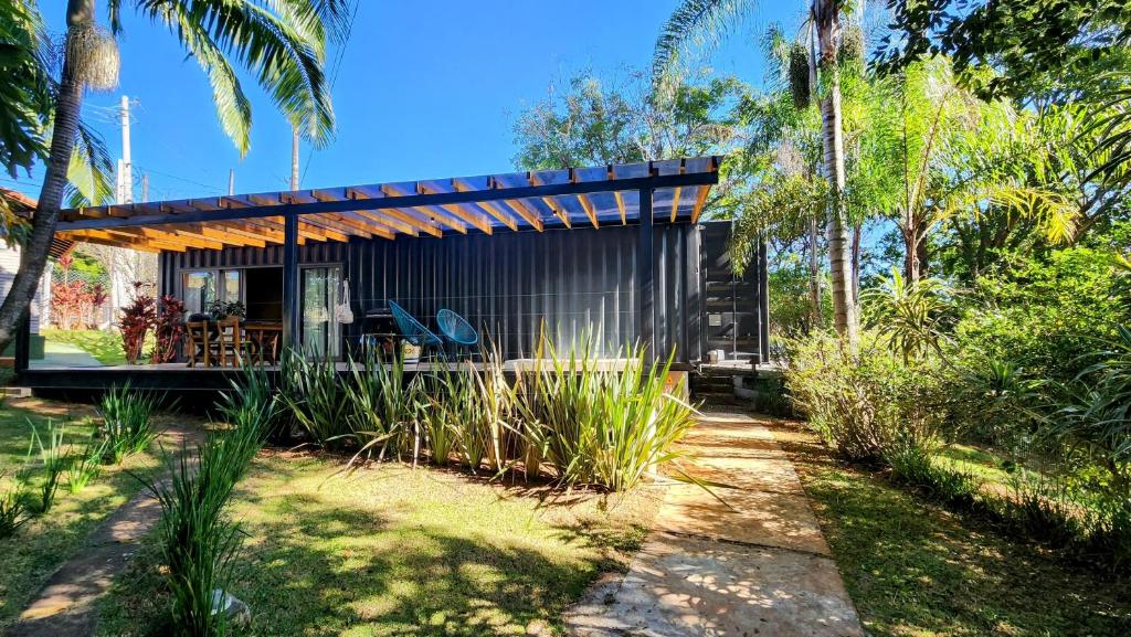 a house in the middle of a yard with palm trees at SPA BOA VISTA - Refugio in Itatiba