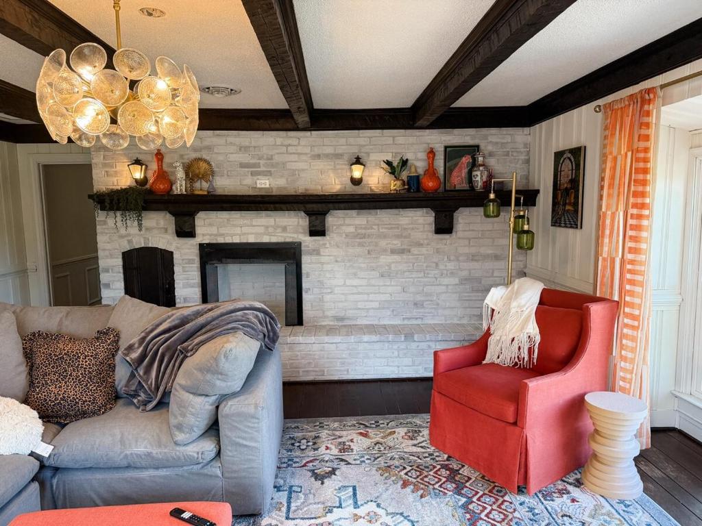 a living room with a couch and a fireplace at The Joyful Escape in Crewe