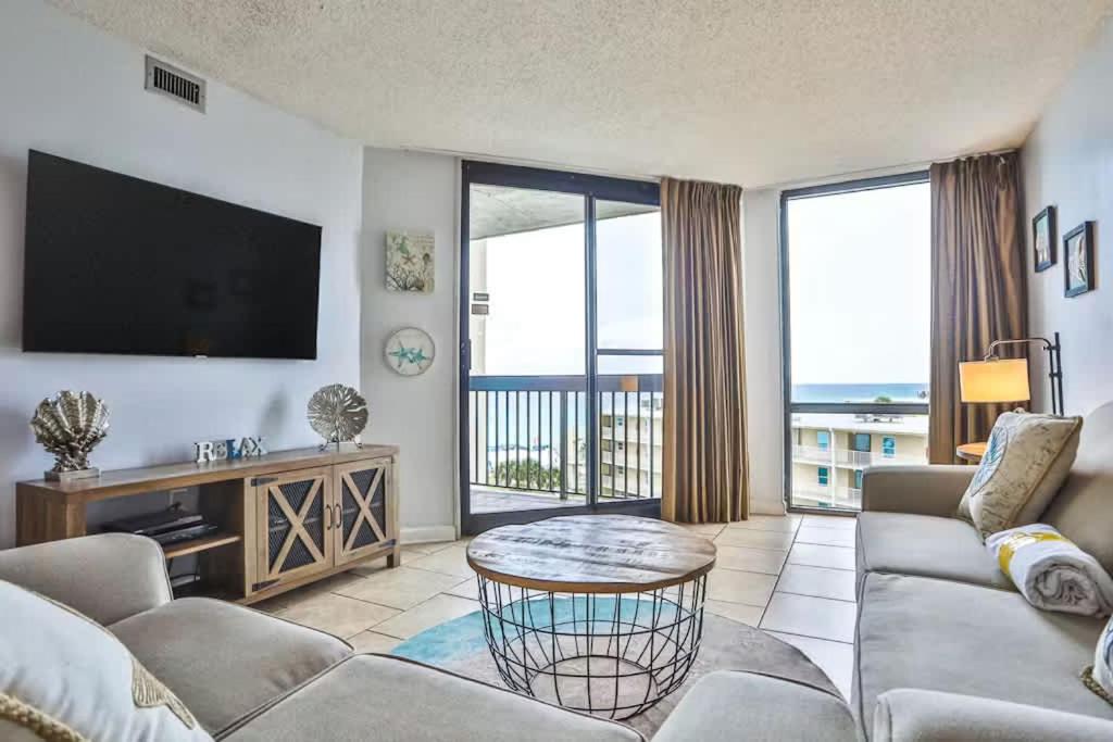 a living room with a couch and a flat screen tv at SunDestin Resort Unit 0615 in Destin