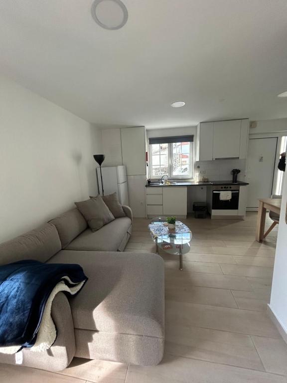 a living room with a couch and a table at Encanto do Rio in Bragança