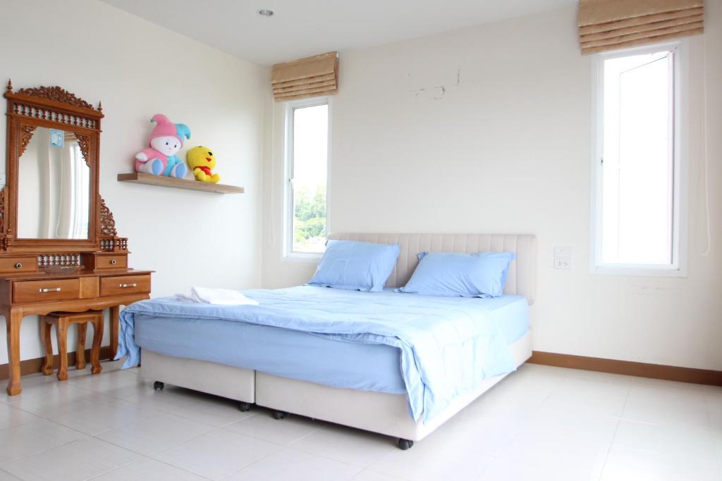 Postel nebo postele na pokoji v ubytování Uncle House Krabi