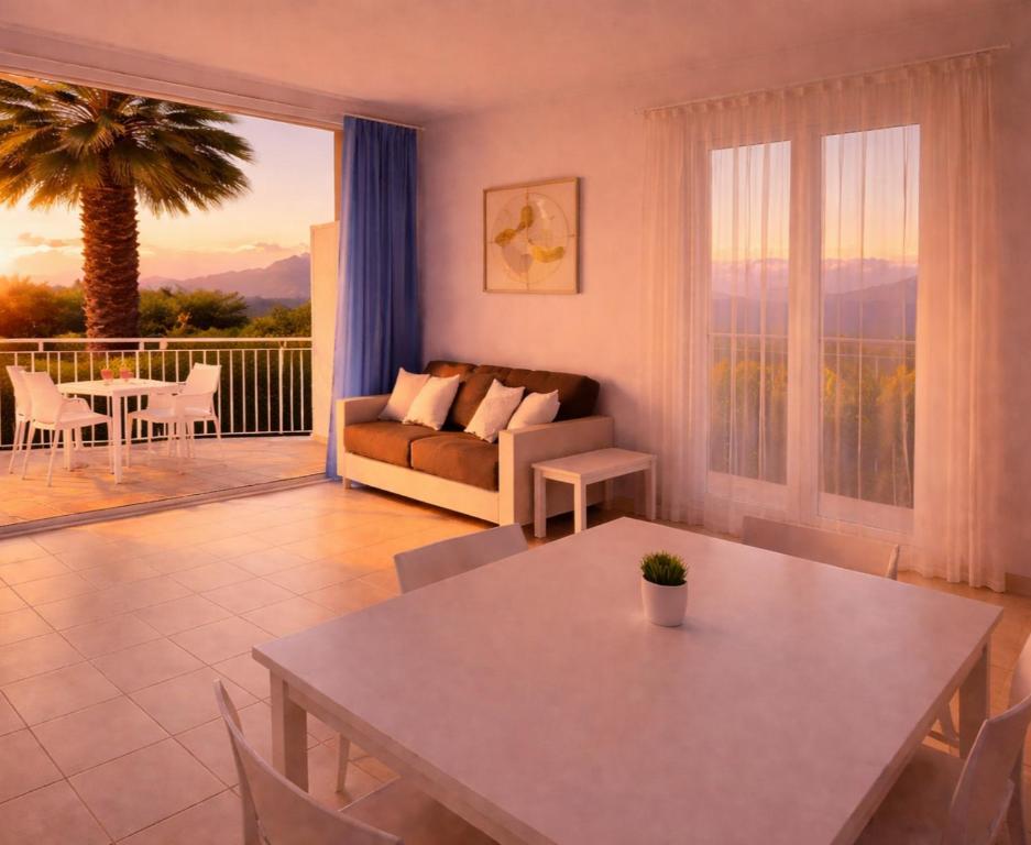 a living room with a table and a couch at ALBACHIARA INN Residence Apartments in Ameglia