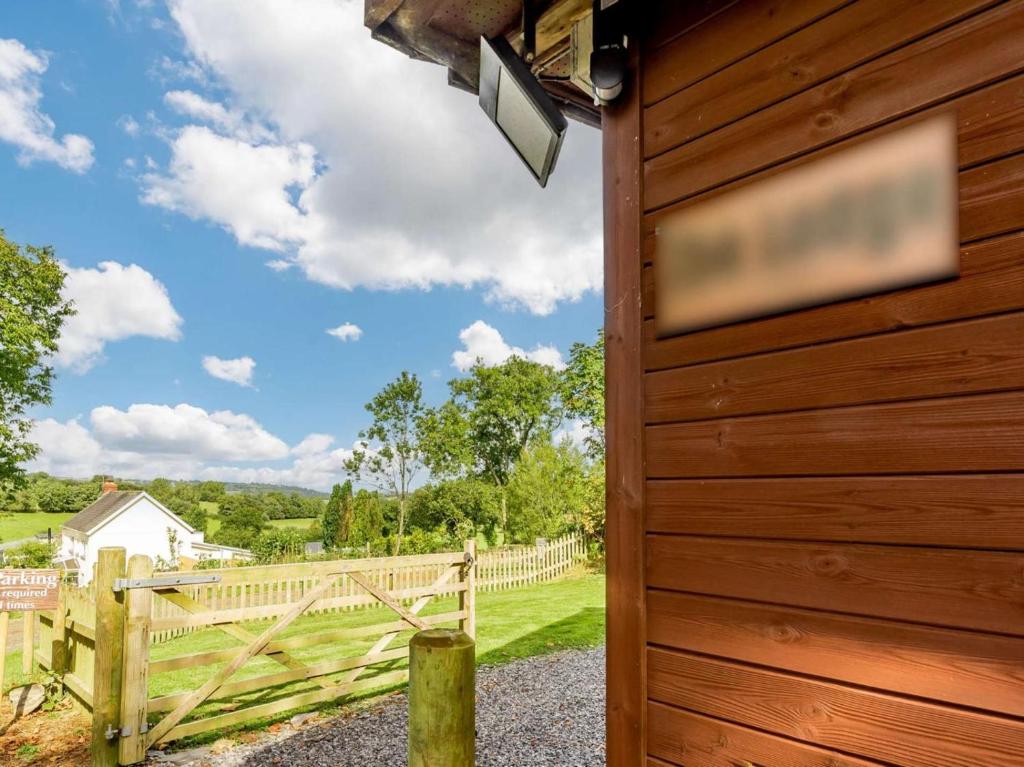 a wooden door with a view of a fence at 2 Bed in Pencader oc-89500 in Pencader