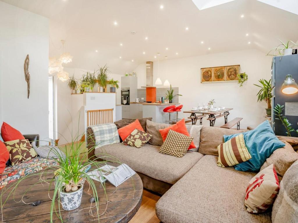 a living room with a couch and a table at 4 Bed in Llandysul oc-93546 in Henllan
