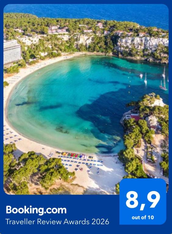 an aerial view of a beach with blue water at HOLIDAYS MENORCA Cala Galdana in Cala Galdana