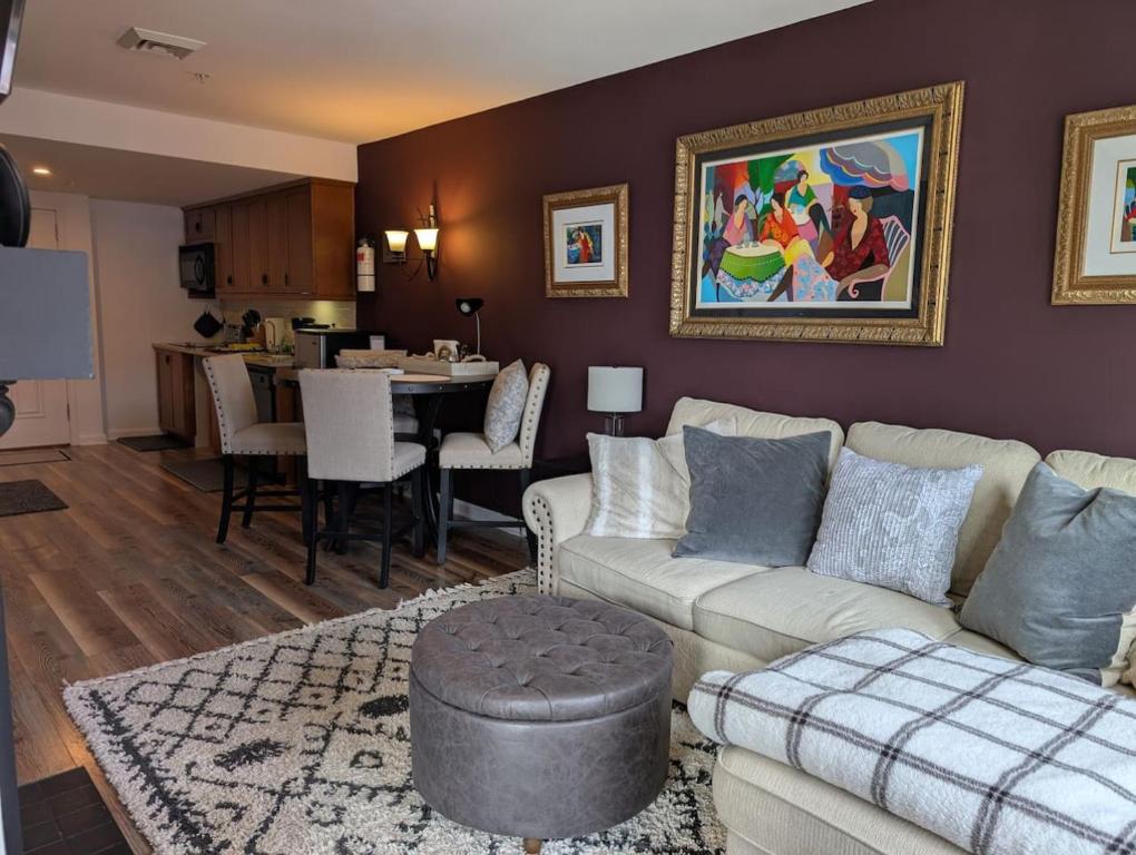 a living room with a couch and a dining room at Mt. Slope Great View 1 Bed Condo in Vernon Township