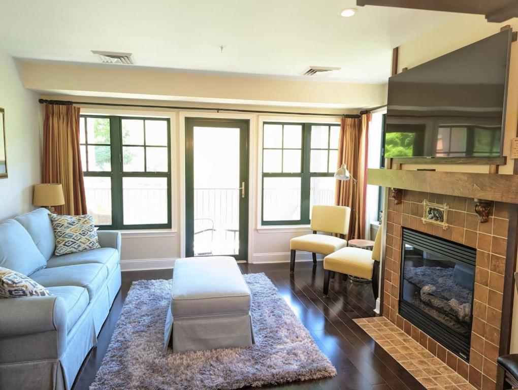 a living room with a couch and a fireplace at Great Views 2 Bed 2 Bath Updated in Vernon Township