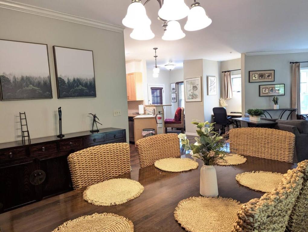 a living room with a dining table and chairs at Spacious 3 bed 2 bath Sanctuary in Vernon Township
