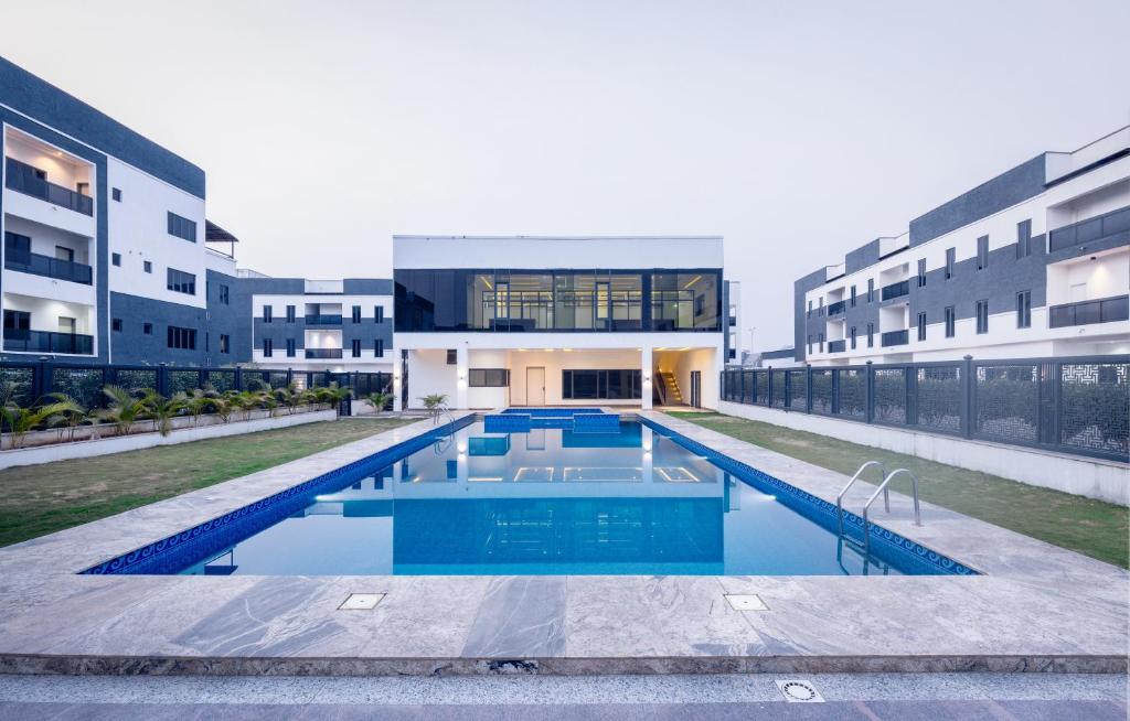 a swimming pool in the middle of a building at D'Crown Place in Abuja