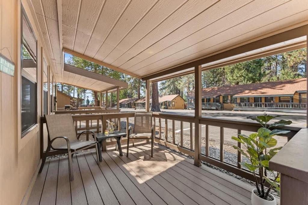 a large deck with a table and chairs on it at Bearfoot Bungalow in Tahoe Vista