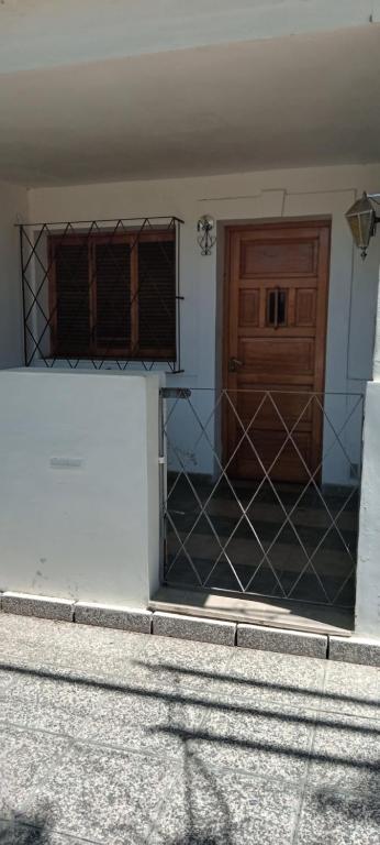 an open door of a building with a wooden door at El Legado in San Pedro