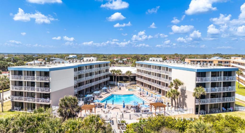an aerial view of a resort with a pool and resort at The Beach Club St Augustine by Coolvacay in Saint Augustine Beach