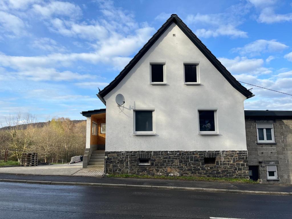 a white house on the side of a street at Villa Maria in Westerburg