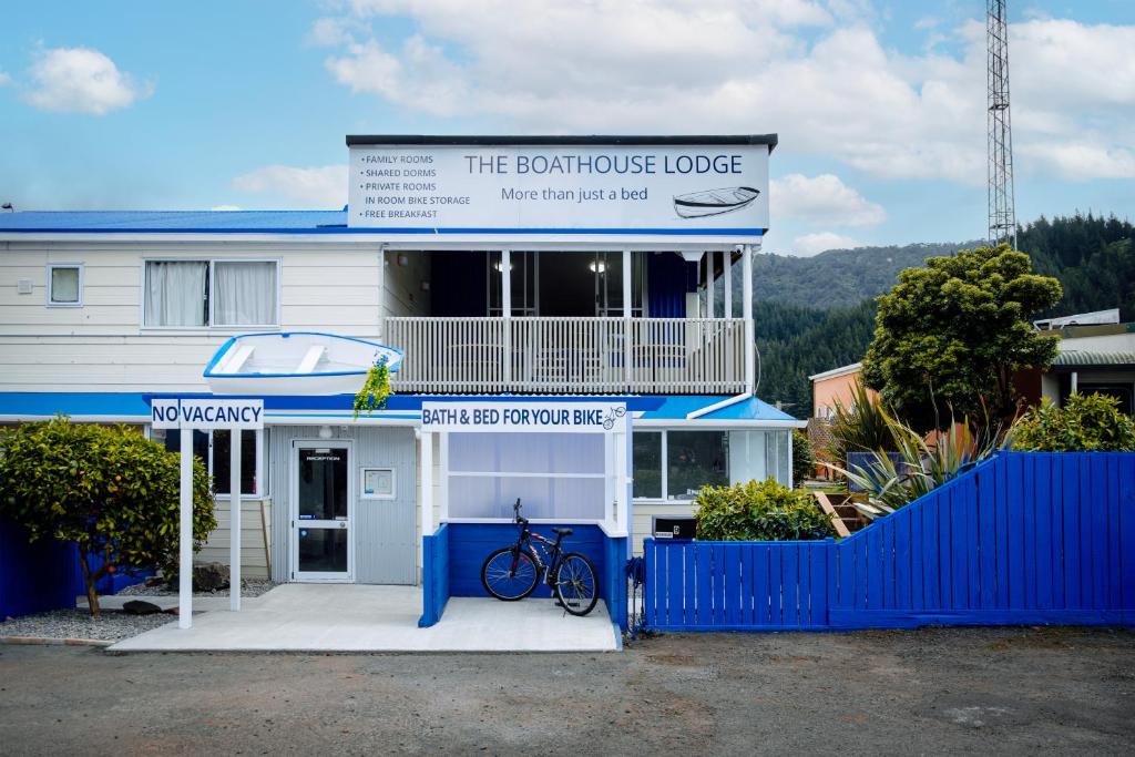 a building with a bike parked in front of it at The Boathouse Lodge in Picton