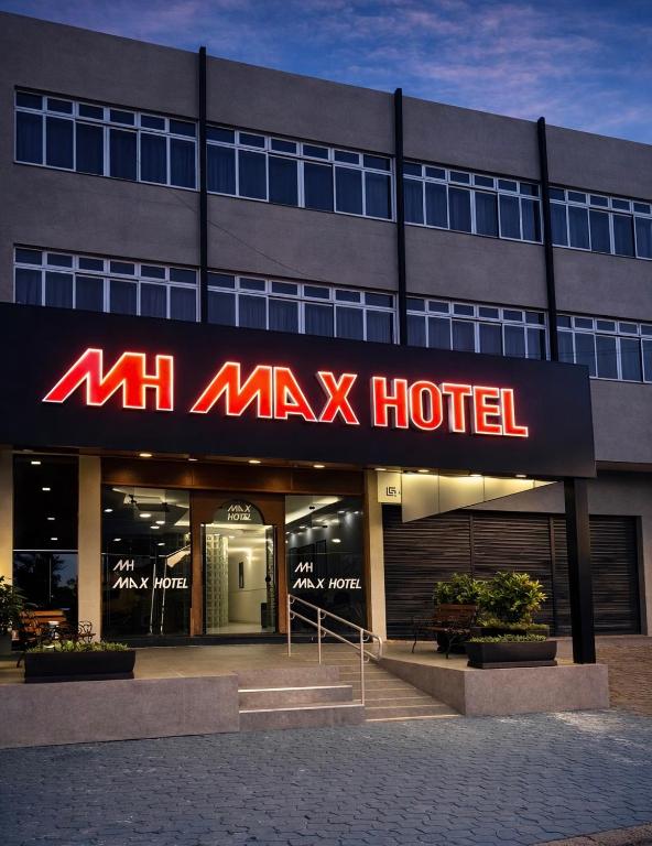 a large building with a large sign on it at Max Hotel in Brasília
