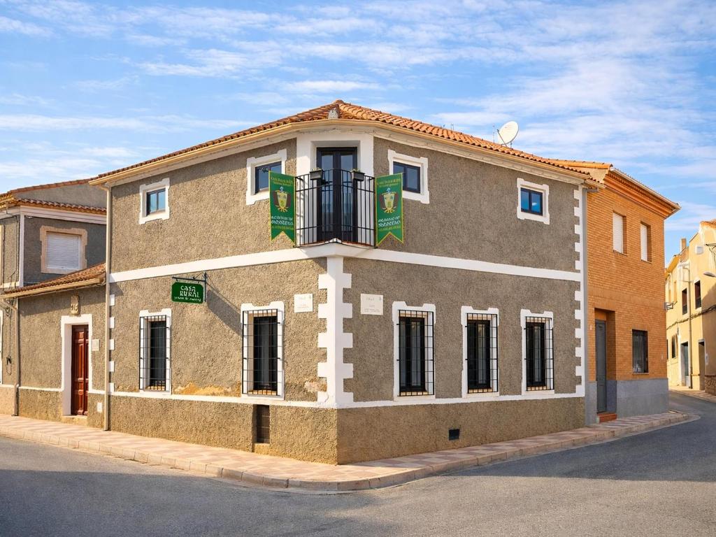 a building on the corner of a street at Medieval country house Señorío de Montero in Cenizate