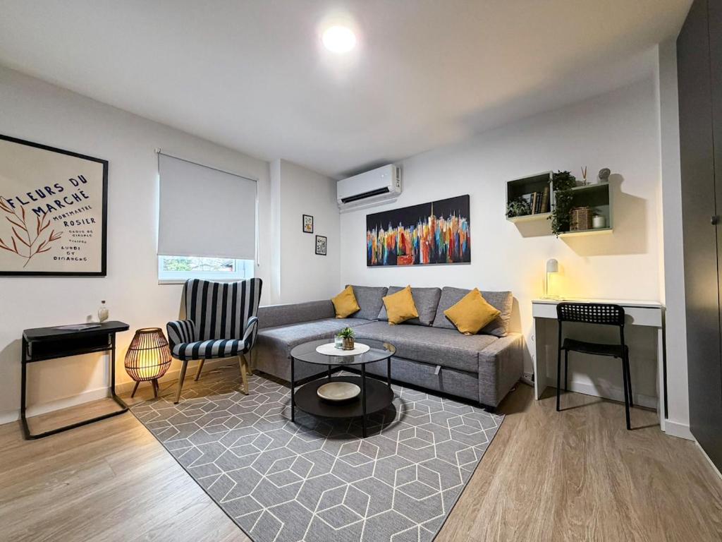a living room with a couch and a table at Apartman Mali Muk 2, self check in in Karlovac