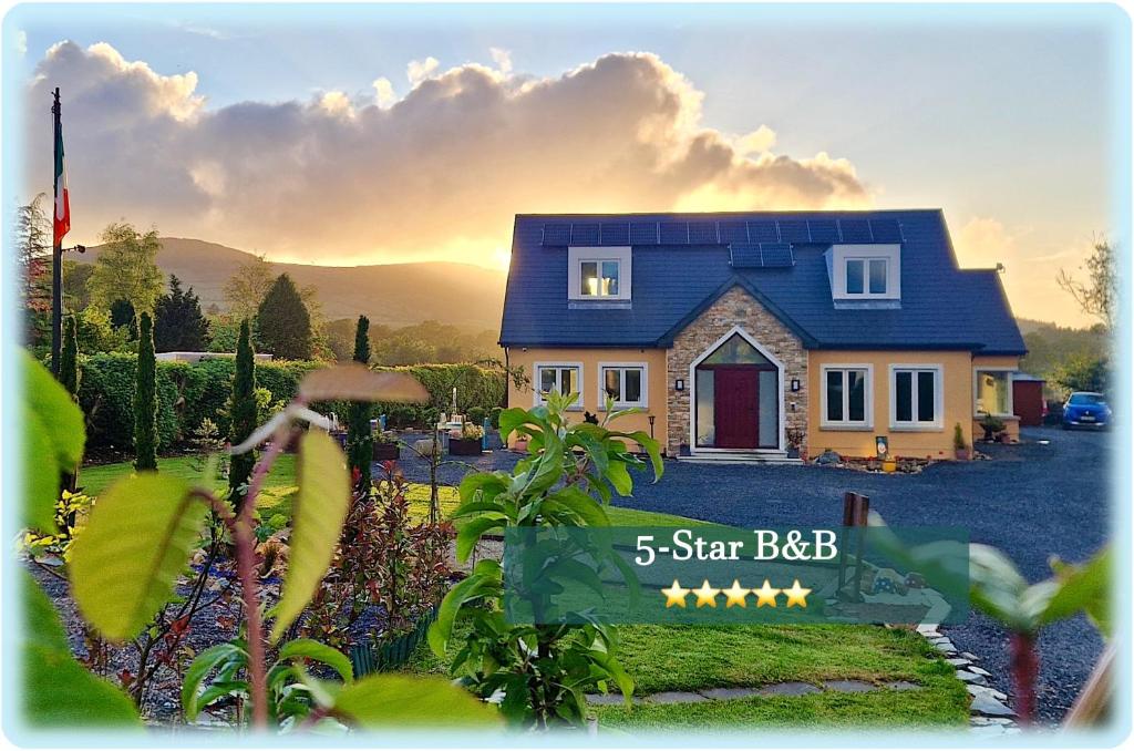 a house with a sign in front of it at Mon Petit Cottage - B&B and Guest House in Bunclody in Bunclody