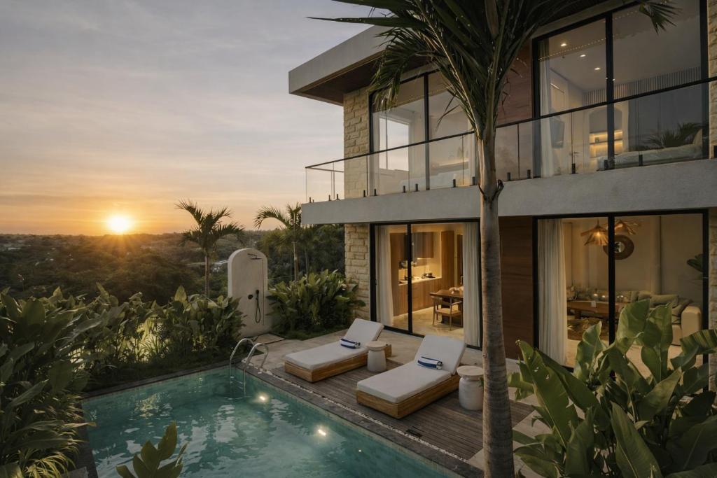 a villa with a swimming pool and a house at White Residence by Iji in Uluwatu