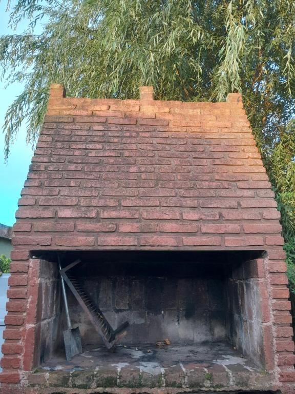 a brick oven with a tree on top of it at Depto in Navarro