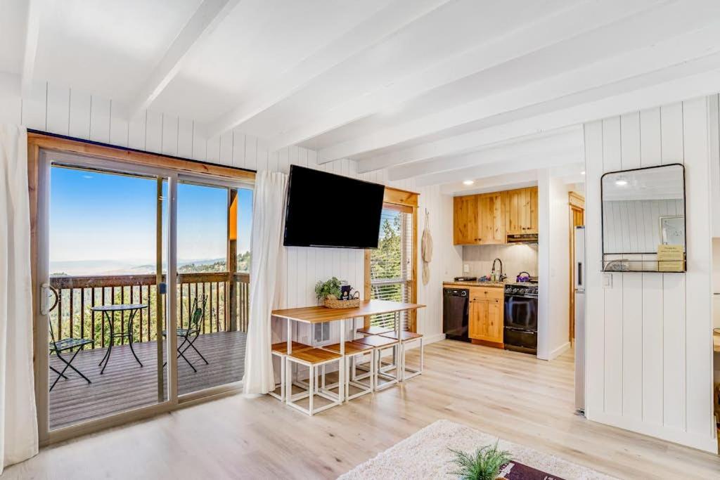 a kitchen with a view of the ocean from a balcony at Ski-In Ski-Out Studio at Bogus Basin in Boise