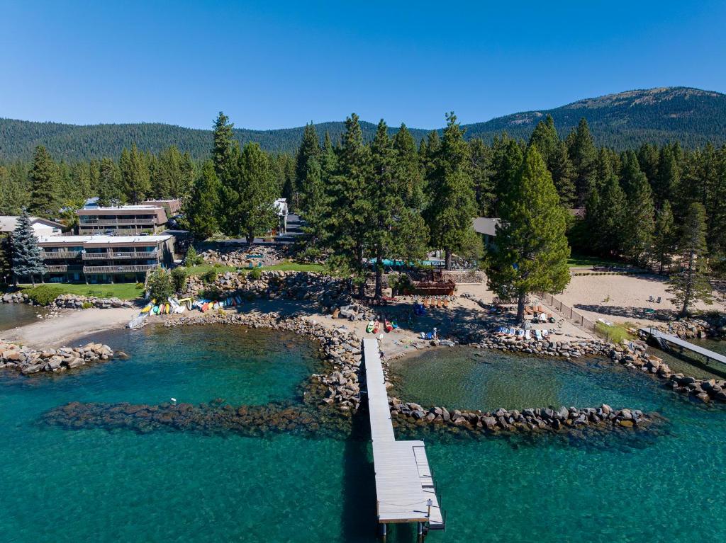 an aerial view of a beach with a bridge in the water at Red Wolf Lakeside Lodge in Tahoe Vista