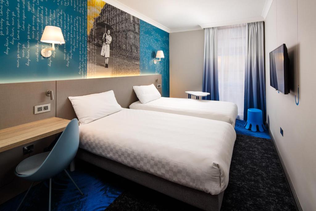 Кровать или кровати в номере ibis Styles Manchester Portland