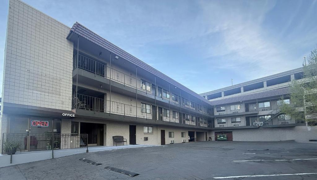 an empty parking lot in front of a building at Red Roof Inn Reno in Reno