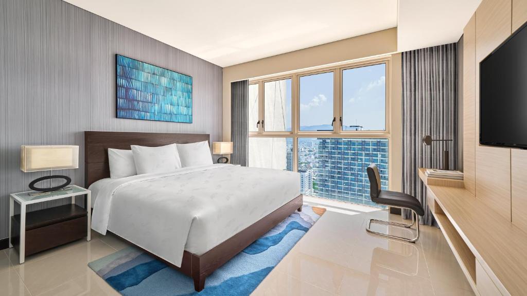 Two-Bedroom King Suite with Two Single Beds and City View