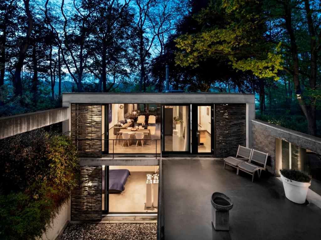 a house with a view of a patio at Wellness Villa with Private Spa in Oosterhout