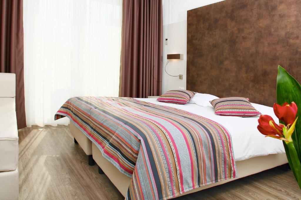 Cama o camas de una habitación en Colorado Hotel