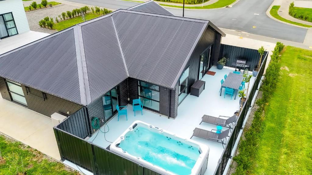 an overhead view of a house with a swimming pool at The Red Door in Martinborough