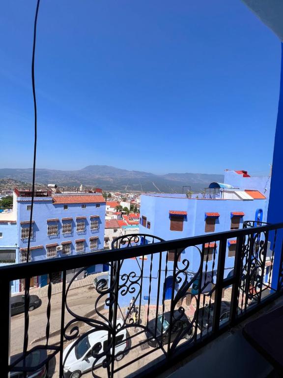 a view of a city from a balcony at Casa Sharawy in Chefchaouen