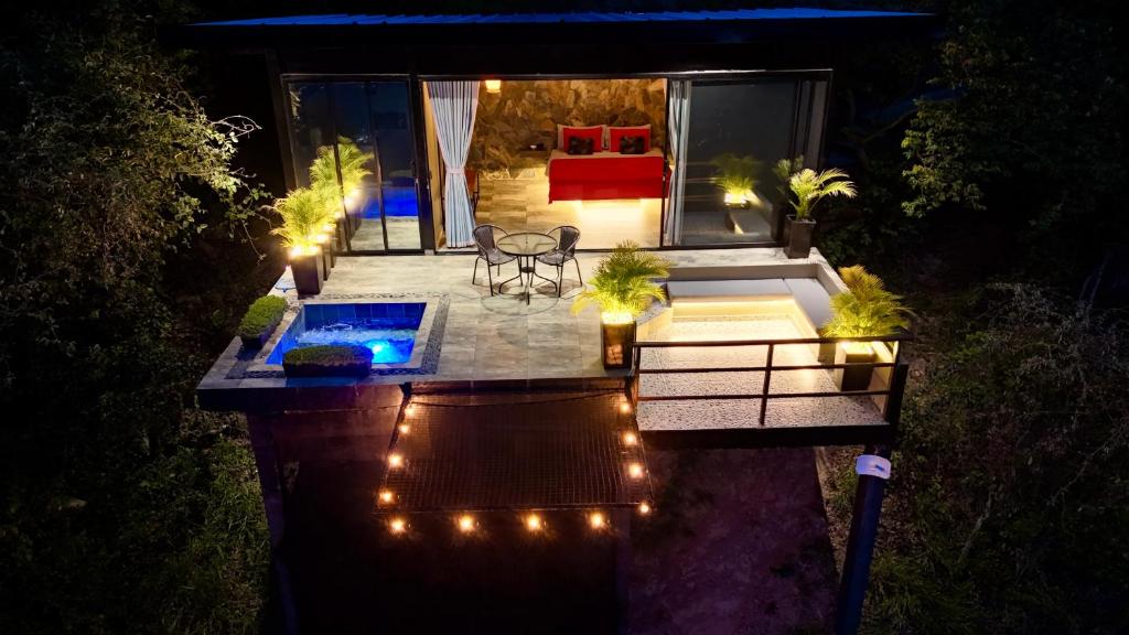 an overhead view of a patio at night with lights at Arrayán Glamping Villa 2 in San Gil