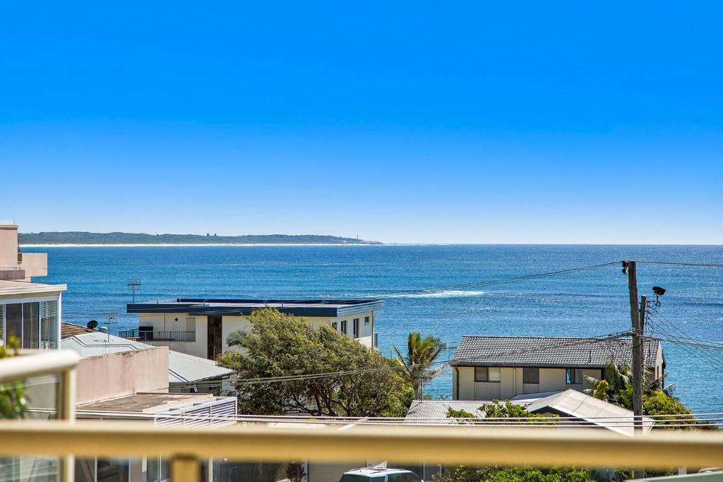 a view of the ocean from a balcony at Pacific Breeze 11 in Blue Bay 